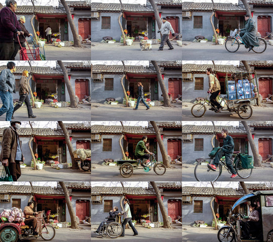 FLOW timelapse photo of a Hutong in Beijing with people communting, riding bikes, strolling and shopping