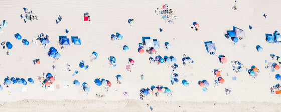 Panoramic color aerial photo of Manhattan Beach in Los Angeles with beach umbrellas, sand