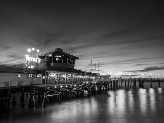 Old Tony's bar on the Redondo Beach pier at sunset, in black and white