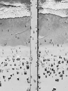  Black and white aerial photo of Manhattan Beach Pier in Los Angeles with beach umbrellas, sand and the ocean