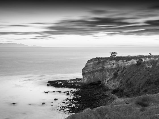 Sunset from the cliffs of Palos Verdes California, with the Pacific Ocean and Catalina Island in the distance, in black and white