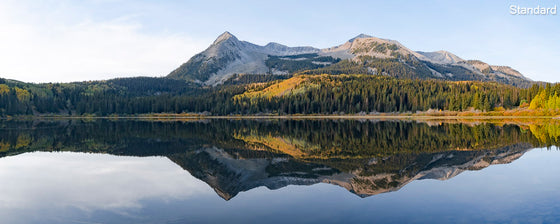 Beautiful colorful Alpine Mirror image from a Colorado Alpine lake with mountaintops and trees.