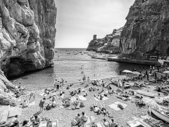 Praiano beach on the Amalfi Coast in Italy in the summertime in black and white.