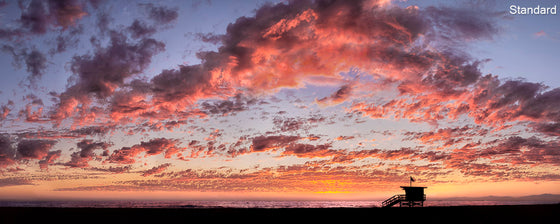 A panoramic photo of a lifeguard tower in Hermosa Beach / Manhattan Beach (Los Angeles California) at sunset.