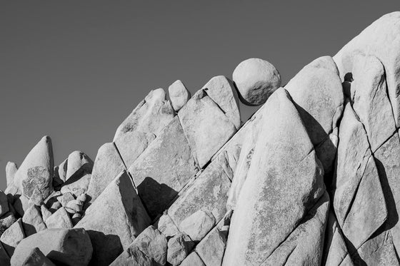 A boulder formation in Joshua Tree, California, in black and white