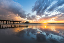  Manhattan Beach pier at sunset with a low tide and reflection of the pier and clouds