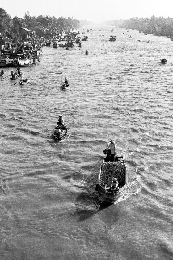 Boats on the Mekong river in black and white.