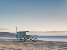  A horizontal picture of a lifeguard tower in Redondo Beach with Palos Verdes in the background