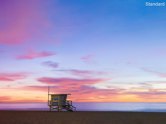 A  photo of a lifeguard tower in Manhattan Beach (Los Angeles California) at sunset.