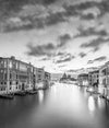 Black and white photo of Venice Italy and the grand canal, photographed from the Accademia bridge on the grand canal, looking toward basilica di santa maria della salute
