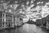 Black and white photo of the Grand Canal and the Basilica di Santa Maria della Salute, in Venice Italy, taken at sunset