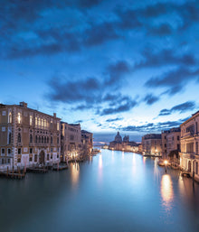  Venice and the grand canal, photographed at the blue hour from the Accademia bridge on the grand canal, looking toward basilica di santa maria della salute