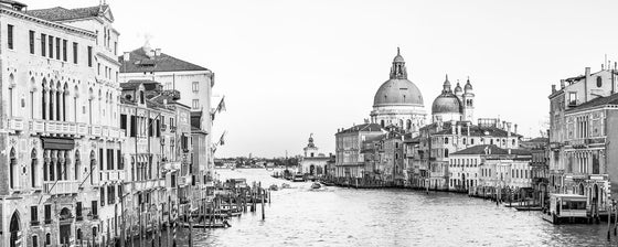 Black and white panoramic photo of the Grand Canal and Basilica di Santa Maria della Salute in Venice Italy