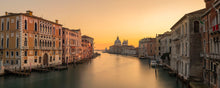 The Grand Canal and Basilica di Santa Maria della Salute in Venice Italy at golden hour after sunset