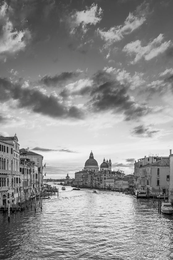 Vertical photo of Venice Italy, the Grand Canal and the Basilica di Santa Maria della Salute (aka The Salute), taken at dusk, in black and white