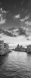 Vertical panoramic photo of Venice Italy, the Grand Canal and the Basilica di Santa Maria della Salute (aka The Salute), taken at dusk, in black and white