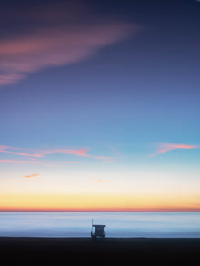  photo of a lifeguard tower taken in Los Angeles, CA during sunset