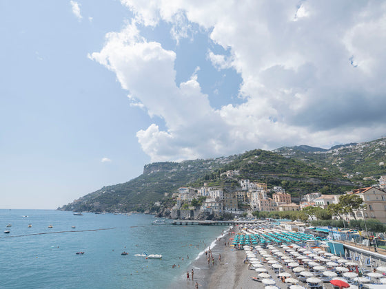 Amalfi Town on the Amalfi Coast with Beach Clubs and big white cloudscape..