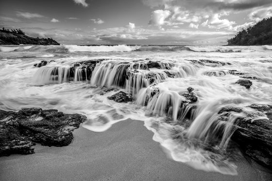  photo of waterfalls in Hawaii along the coast of Kauai, in black and white