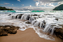   photo of waterfalls in Hawaii along the coast of Kauai