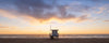 Sunset on the beach with a Los Angeles lifeguard tower.