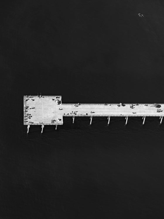 Black and white aerial photo of Hermosa Beach Pier in Los Angeles