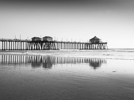 The Huntington Beach Pier, low tide, black and white