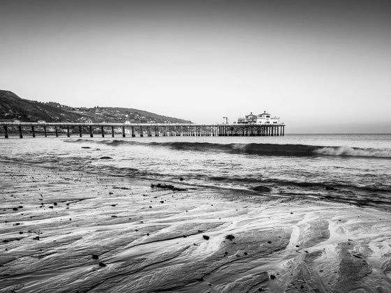 The Malibu pier, sunset, low tide, black and white