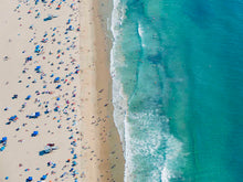  Color aerial photo of Manhattan Beach in Los Angeles with beach umbrellas, two lifeguard towers and the ocean