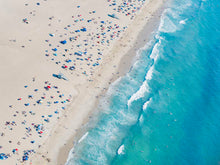  Color aerial photo of Manhattan Beach in Los Angeles with beach umbrellas, two lifeguard towers and the ocean