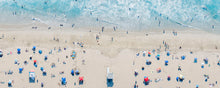  Color aerial photo of Manhattan Beach in Los Angeles with a lifeguard tower, beach umbrellas, sand and the ocean