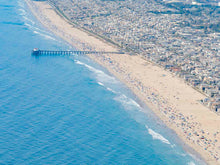  Color aerial photo of Manhattan Beach Pier in Los Angeles with beach umbrellas, sand and the ocean