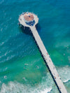 Diagonal color aerial photo of the Manhattan Beach Pier in Los Angeles California