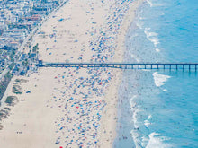 Color aerial photo of Manhattan Beach Pier in Los Angeles with beach umbrellas, sand and the ocean