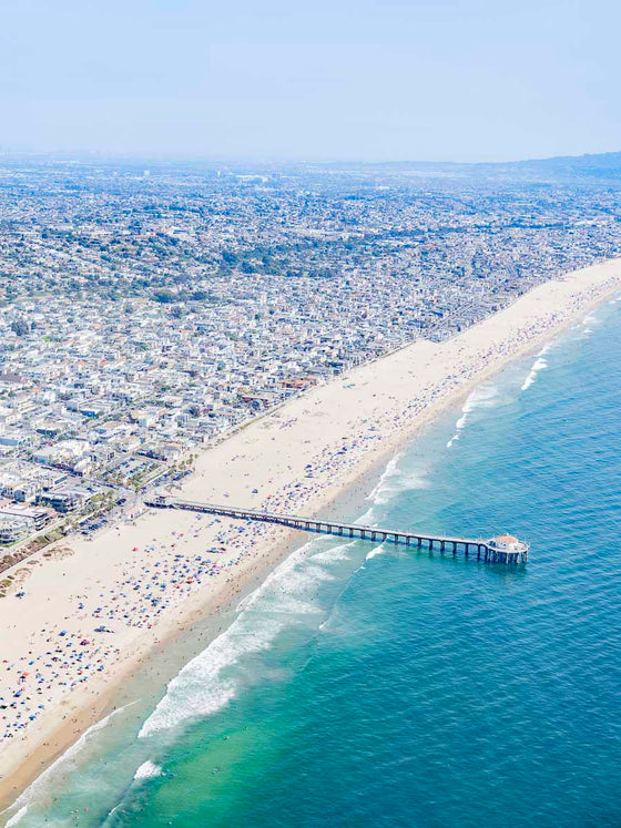 Color aerial photo of Manhattan Beach and the Manhattan Beach Pier in Los Angeles California