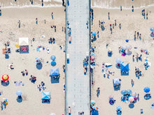  Color aerial photo of Manhattan Beach Pier in Los Angeles with beach umbrellas
