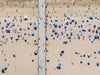 Color aerial photo of Manhattan Beach Pier in Los Angeles with beach umbrellas
