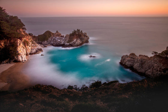 McWay Falls in Big Sur California, at sunset, with a long exposure to give the water a smooth zen-like feeling
