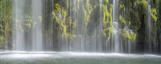 horizontal panoramic photo of a moss covered waterfall, ultra high resolution large format photo