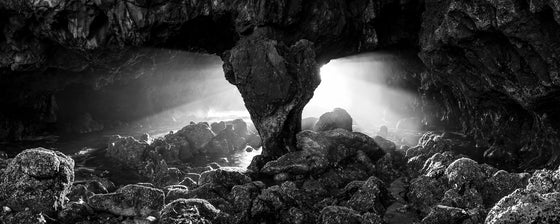 Light streaming through a cave at sunset in Palos Verdes California, sunset, panoramic, black and white