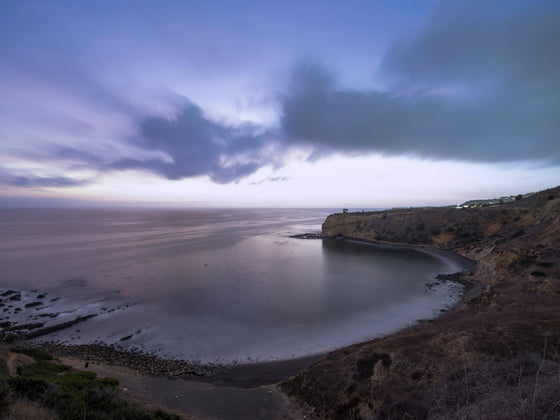Sunset from the cliffs of Palos Verdes California, with the Pacific Ocean and Catalina Island in the distance, as a moody long exposure photo