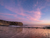 Sunset from the beach of Palos Verdes California, with the Pacific Ocean and low tide on the beach
