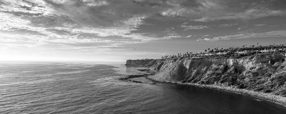 Sunset from the cliffs of Palos Verdes California, with the Pacific Ocean, as a black and white panoramic photo