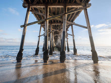  under the balboa pier in newport beach at low tide
